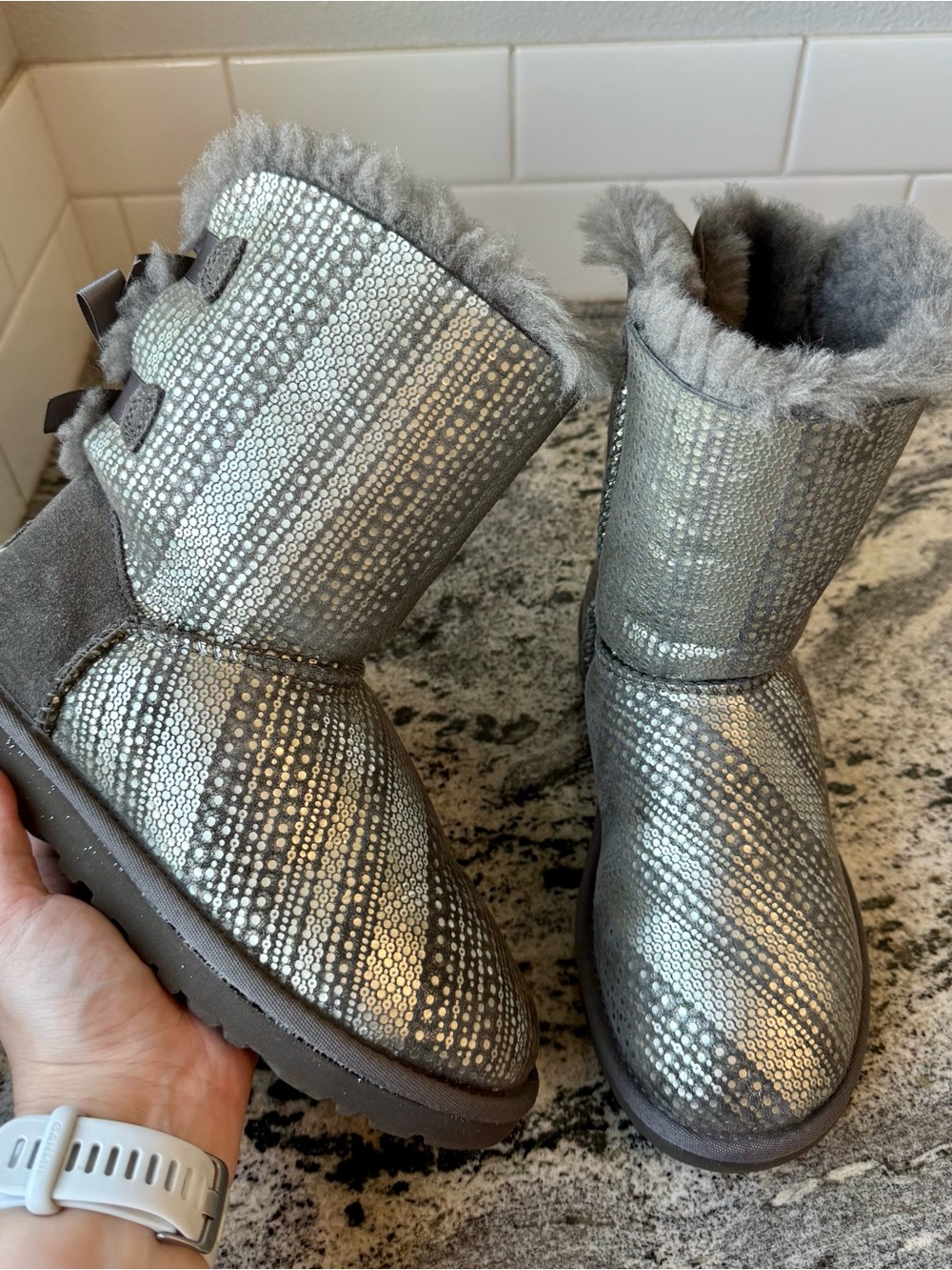 UGG Women's Mini Bailey Bow Metallic Spots boots in Grey / Silver. Size 6.
